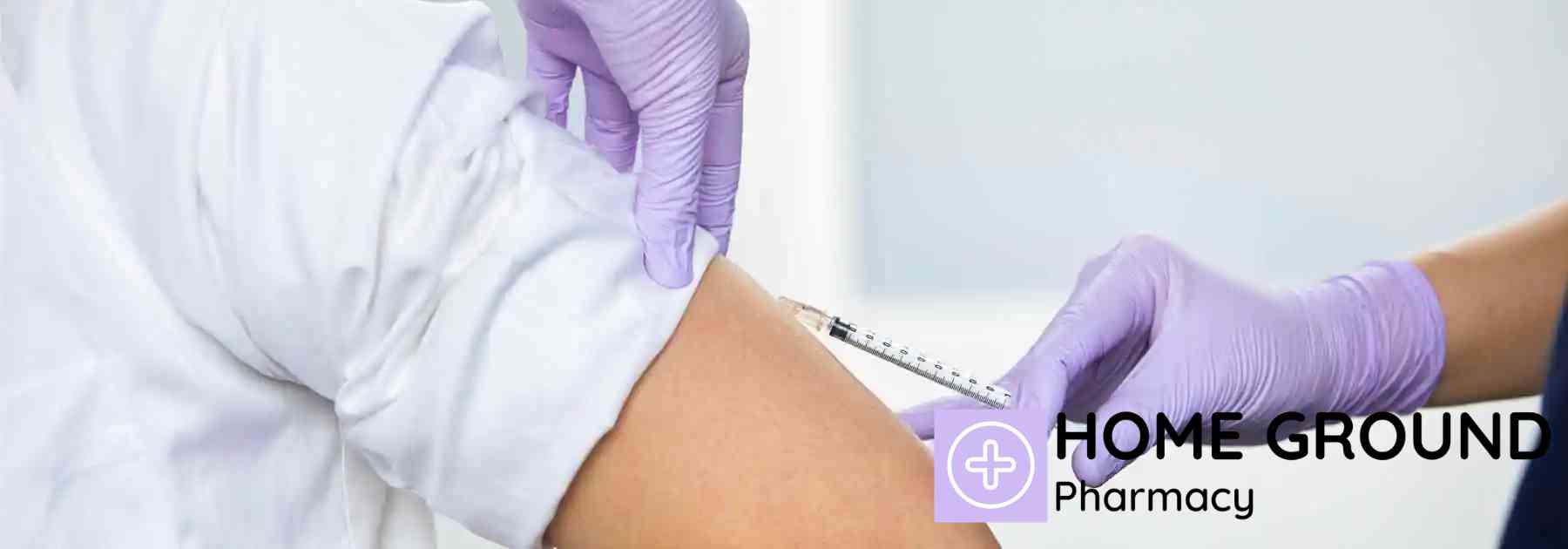 patient in white shirt receiving vaccine in arm