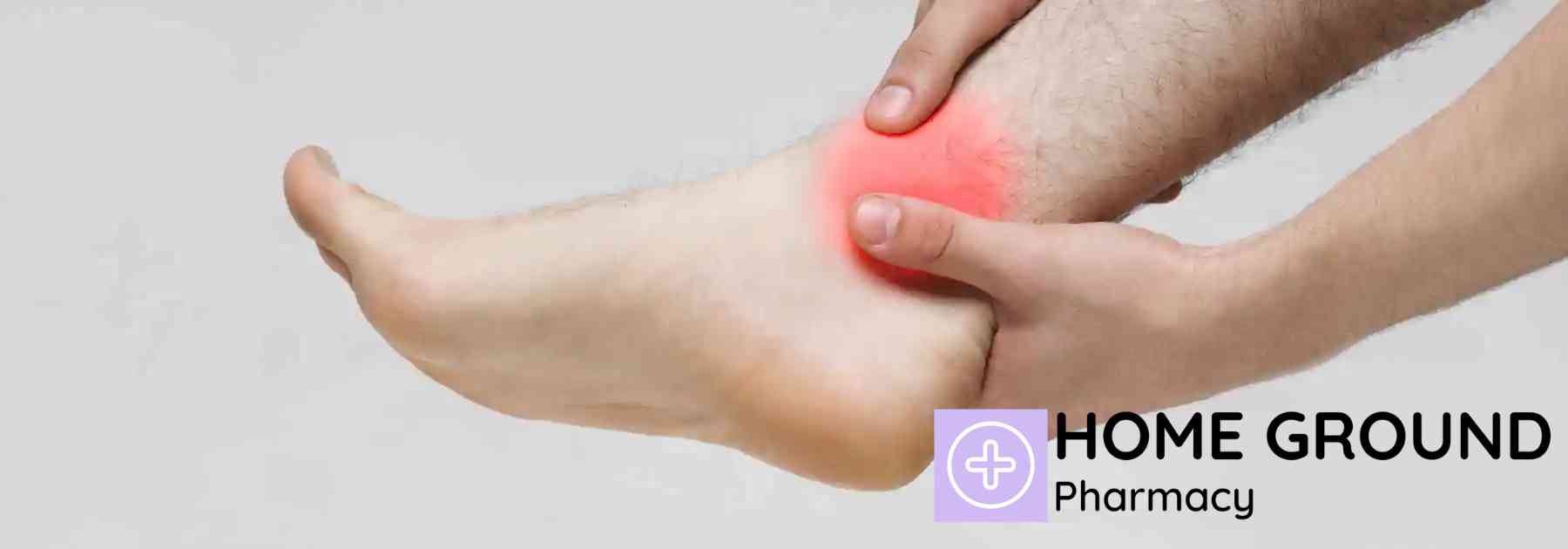 person holding their sprained ankle