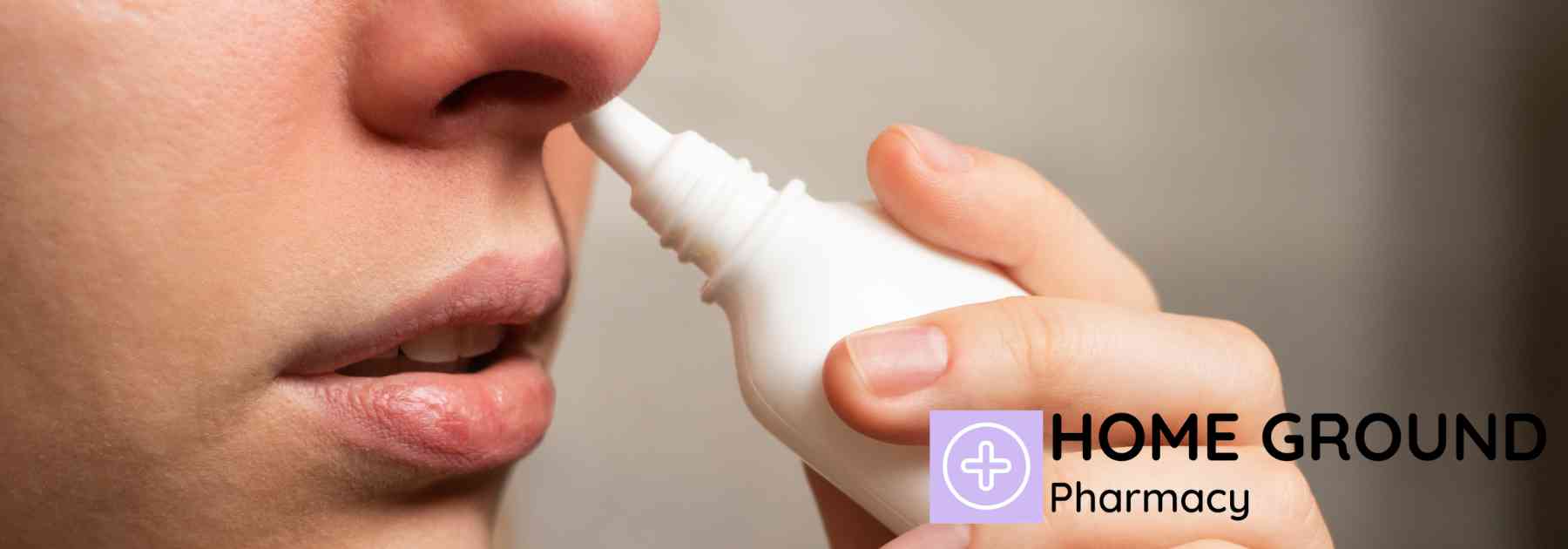 close-up of young woman using nasal spray