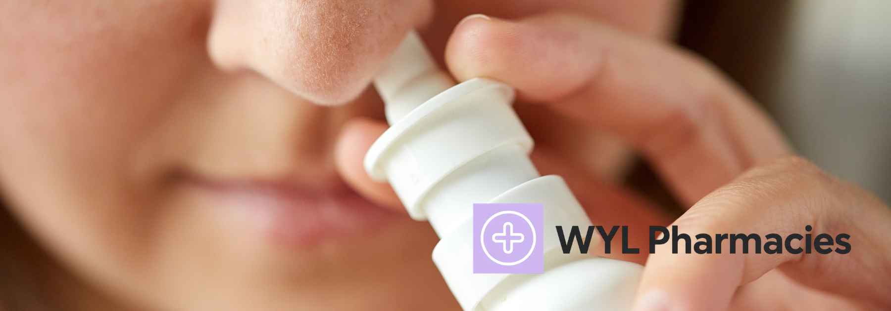 young woman using nasal spray