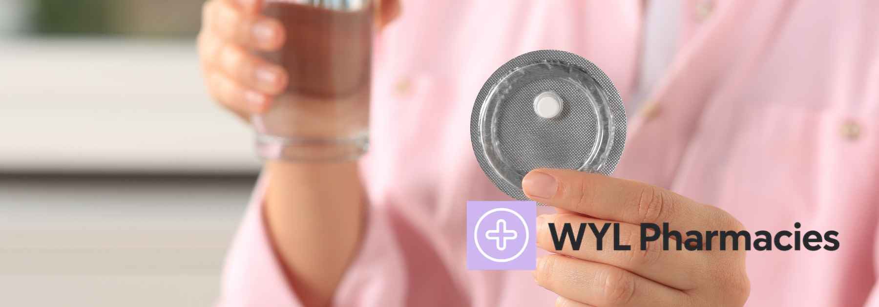 woman in pink shirt holding glass of water and emergency contraceptive pill
